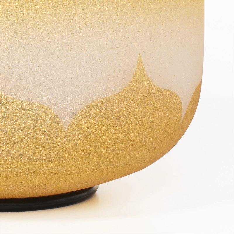 Lotus detail on yellow singing bowl