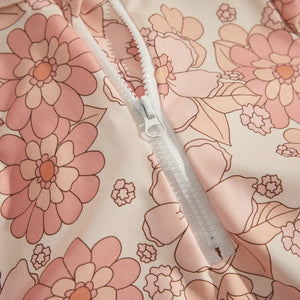 Detail of floral baby rash guard with zipper