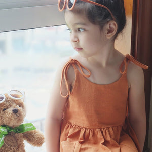 Girl sitting in our "Sweet and Breezy" Linen Summer Dress | Surfersandyogis