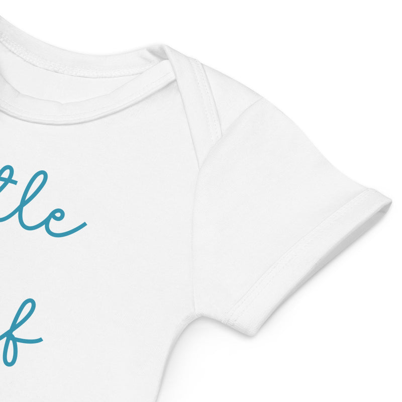 Detail of white organic baby bodysuit